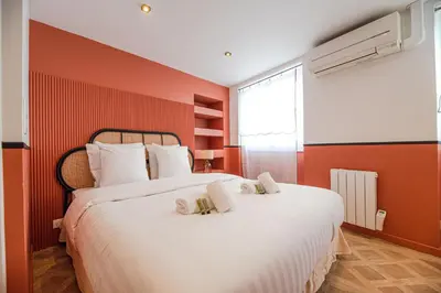 Un ou plusieurs lits dans un hébergement de l'établissement Cosy flats- NOTRE DAME