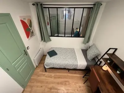 Un ou plusieurs lits dans un hébergement de l'établissement R- Maison 6 chambres 3 min metro 10 lits PARC EXPO