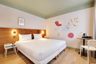 Un ou plusieurs lits dans un hébergement de l'établissement Hôtel Cocoon
