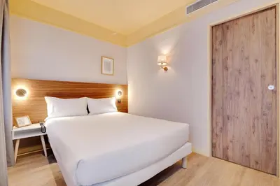 Un ou plusieurs lits dans un hébergement de l'établissement Hôtel Cocoon