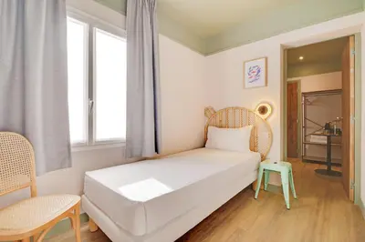 Un ou plusieurs lits dans un hébergement de l'établissement Hôtel Cocoon