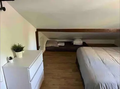 Un ou plusieurs lits dans un hébergement de l'établissement BX - Maison 10 rooms - 12 beds - metro PARIS EXPO
