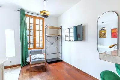 Un ou plusieurs lits dans un hébergement de l'établissement Studio intimiste au cœur du Marais historique