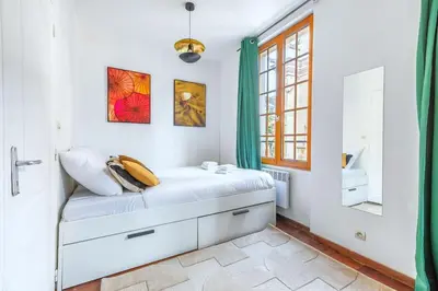 Un ou plusieurs lits dans un hébergement de l'établissement Studio intimiste au cœur du Marais historique