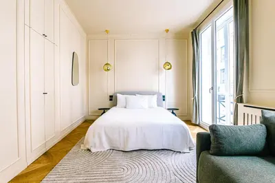 Un ou plusieurs lits dans un hébergement de l'établissement Luxurious Paris Loft Near Opéra