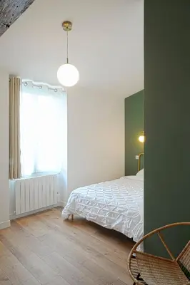 Un ou plusieurs lits dans un hébergement de l'établissement T3 cosy aux portes de Paris
