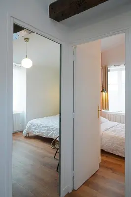 Un ou plusieurs lits dans un hébergement de l'établissement T3 cosy aux portes de Paris