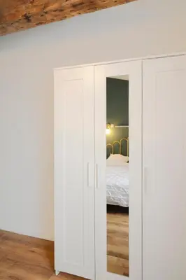 Un ou plusieurs lits dans un hébergement de l'établissement T3 cosy aux portes de Paris