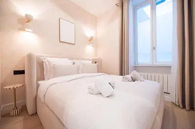 Un ou plusieurs lits dans un hébergement de l'établissement Apartment in montmartre