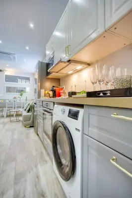 Cuisine ou kitchenette dans l'établissement Le Nid Parisien Triplex Cosy et Chaleureux
