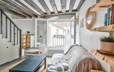 Un ou plusieurs lits dans un hébergement de l'établissement GuestReady - Bright Stay in the Heart of Paris