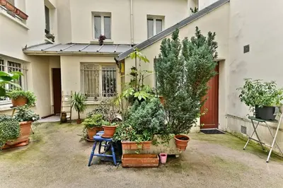 Jardin de l'établissement Appartement proche Canal Saint Martin - II