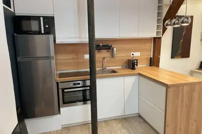 Cuisine ou kitchenette dans l'établissement Heart of Paris