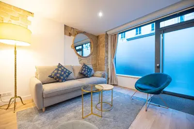 Coin salon dans l'établissement Beautiful Apartment in Saint Germain