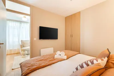 Un ou plusieurs lits dans un hébergement de l'établissement Merveilleux appartement de luxe au coeurs de Saint-Germain