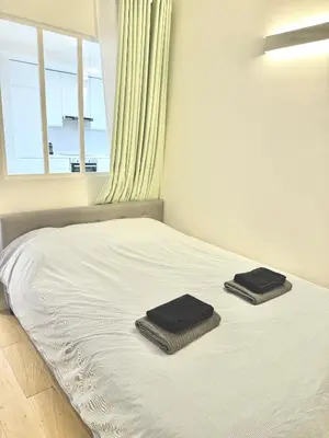 Un ou plusieurs lits dans un hébergement de l'établissement Modern Parisian flat Quartier asiatique Choisy
