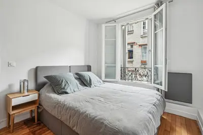 Un ou plusieurs lits dans un hébergement de l'établissement Élégant Tour Eiffel