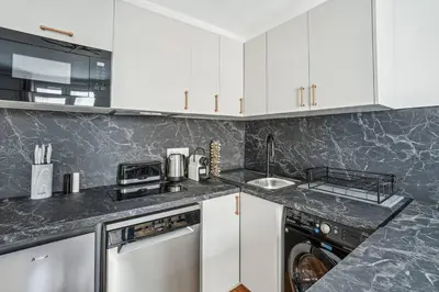 Cuisine ou kitchenette dans l'établissement Élégant Tour Eiffel