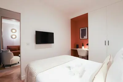 Un ou plusieurs lits dans un hébergement de l'établissement Bel appartement d'architecte au coeur de Paris