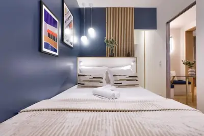 Un ou plusieurs lits dans un hébergement de l'établissement Bel appartement d'architecte au coeur de Paris