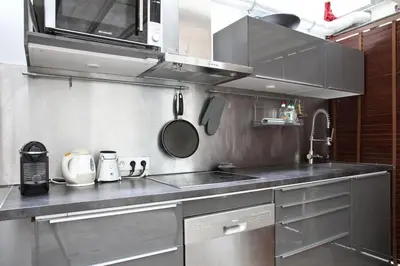 Cuisine ou kitchenette dans l'établissement Unique Loft in Paris near Parc de la Villette