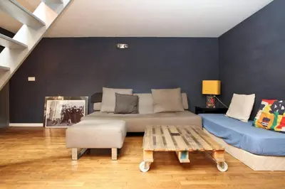 Coin salon dans l'établissement Unique Loft in Paris near Parc de la Villette