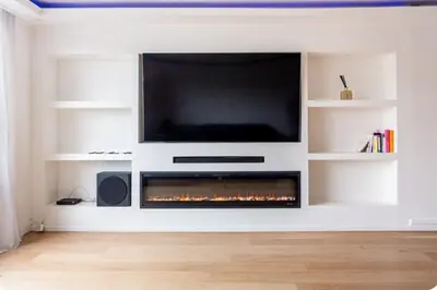 Télévision ou salle de divertissement dans l'établissement 2 bedroom appartement champs Élysée