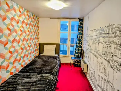 Un ou plusieurs lits dans un hébergement de l'établissement Opera Louvre HolidayApartment