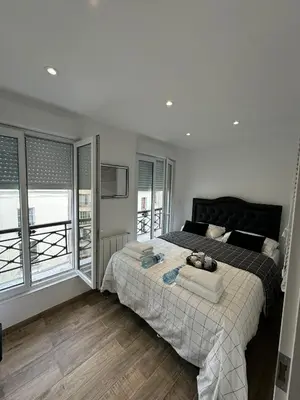 Un ou plusieurs lits dans un hébergement de l'établissement Appartement de Brigitte