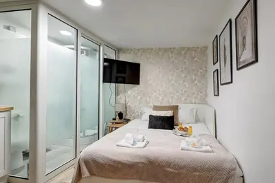 Un ou plusieurs lits dans un hébergement de l'établissement Élégant studio de prestige au cœur de Paris