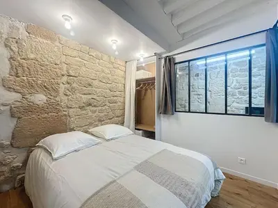 Un ou plusieurs lits dans un hébergement de l'établissement Loft en plein coeur du Marais