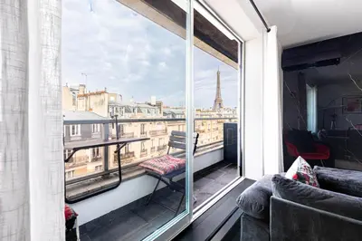 Coin salon dans l'établissement GuestReady - View of the Eiffel Tower ideal for 2
