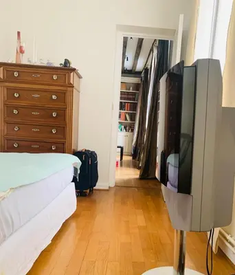 Un ou plusieurs lits dans un hébergement de l'établissement Lux Apartment Marais Temple