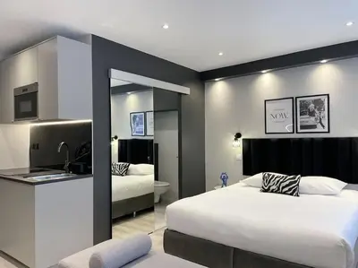 Un ou plusieurs lits dans un hébergement de l'établissement Charming Studio Paris Marais, République, Bastille