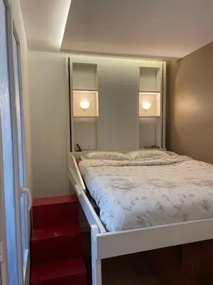 Un ou plusieurs lits dans un hébergement de l'établissement Appartement au cœur de Paris