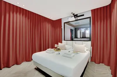 Un ou plusieurs lits dans un hébergement de l'établissement Magnifique Studio 2P avec Jacuzzi et Cinema