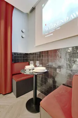 Coin salon dans l'établissement Magnifique Studio 2P avec Jacuzzi et Cinema