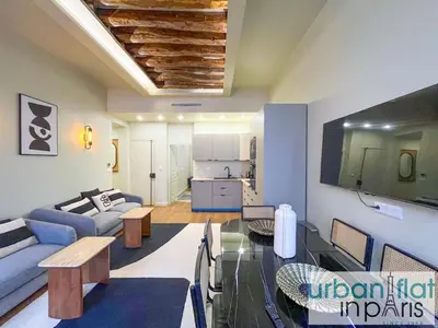 Un ou plusieurs lits dans un hébergement de l'établissement Urban Flat 188 - Stunning 4 Bedroom Flat in Paris