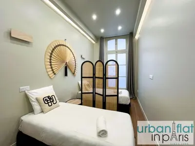 Un ou plusieurs lits dans un hébergement de l'établissement Urban Flat 188 - Stunning 4 Bedroom Flat in Paris