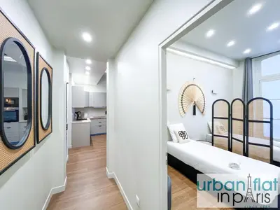 Un ou plusieurs lits dans un hébergement de l'établissement Urban Flat 188 - Stunning 4 Bedroom Flat in Paris