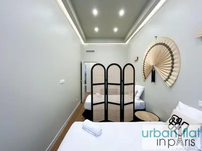 Un ou plusieurs lits dans un hébergement de l'établissement Urban Flat 188 - Stunning 4 Bedroom Flat in Paris