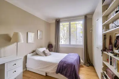 Un ou plusieurs lits dans un hébergement de l'établissement Appart calme à Buttes-Chaumont