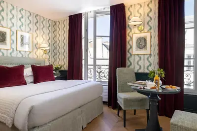 Un ou plusieurs lits dans un hébergement de l'établissement Hotel du Champ de Mars