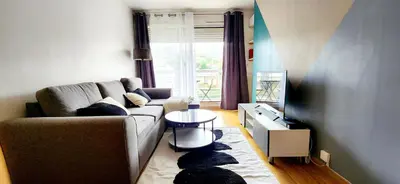 Coin salon dans l'établissement Modern apartment with balcony