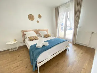 Un ou plusieurs lits dans un hébergement de l'établissement Le Charme des Docks by So Homy - 1 Bed Room - 4 PAX