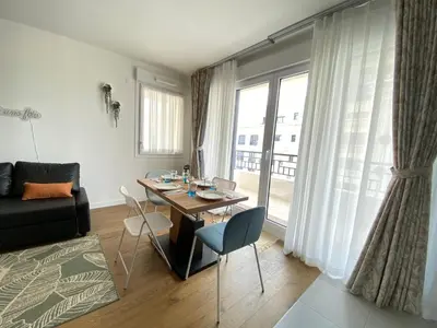Coin salon dans l'établissement Le Charme des Docks by So Homy - 1 Bed Room - 4 PAX