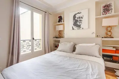 Un ou plusieurs lits dans un hébergement de l'établissement Lovely Appartment Montmartre - View Sacré coeur