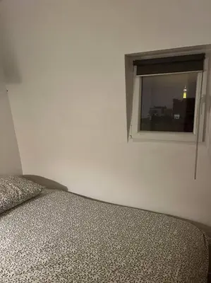 Un ou plusieurs lits dans un hébergement de l'établissement Appartement T2 - Vue Tour Eiffel