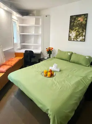 Un ou plusieurs lits dans un hébergement de l'établissement Studio The Champs-Élysées