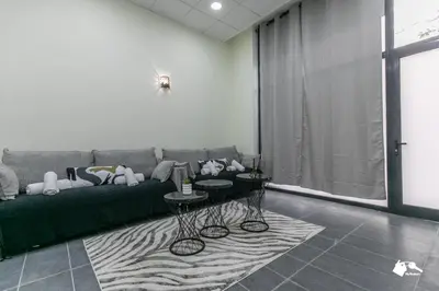Coin salon dans l'établissement MBA - Lecourbe Splendide Appartement